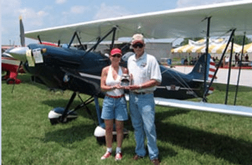 Photo of Sam and Mindy Lyons at an airshow.